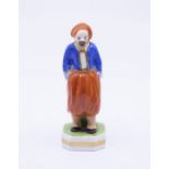 An S & H Derby King St Factory figure of a Turkish gentleman decorated in bright colours, puce mark,