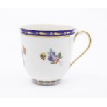 A Derby Puce mark coffee cup, c.1790, combed shape, unusually decorated with flower groups by