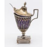 An early 19th Century French 950 standard silver mustard pot and cover, pierced urn shaped body on