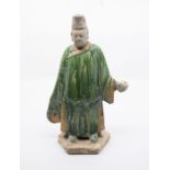 **Please note amended guide** A Chinese Tang dynasty figure with green glazed robes.