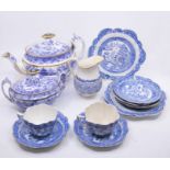 A collection of various blue and white Willow Pattern teaware, circa 1810 including teapot, sugar