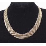 Two 9ct gold necklace chains to include a fringe Cleopatra style collar, bolt clasp, length approx
