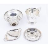 A collection of 20th Century silver tableware to include: Modern circular ring dish; a circular