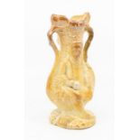 A toast coloured salt glazed spill vase, moulded with Tam O Shanter and Souter Johnny figures,