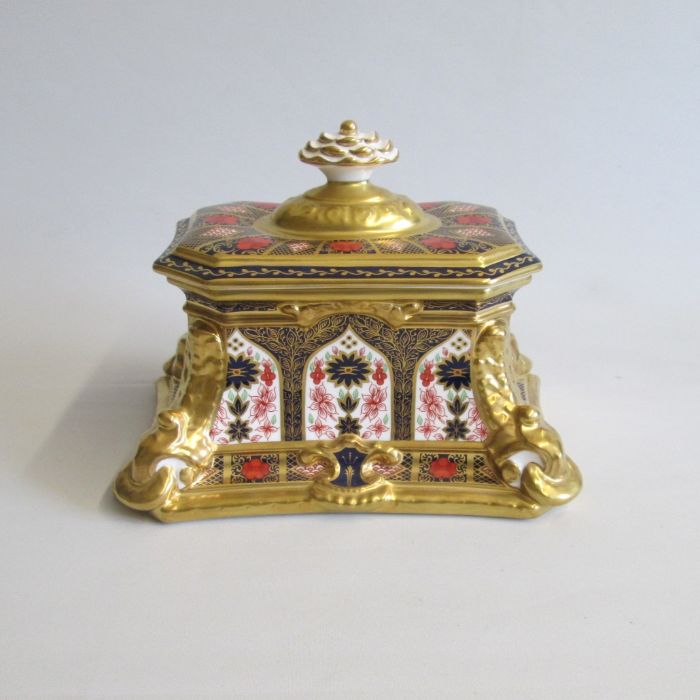 A Royal Crown Derby Scroll Box and cover, decorated in the ‘Old Imari’ pattern. First quality Date