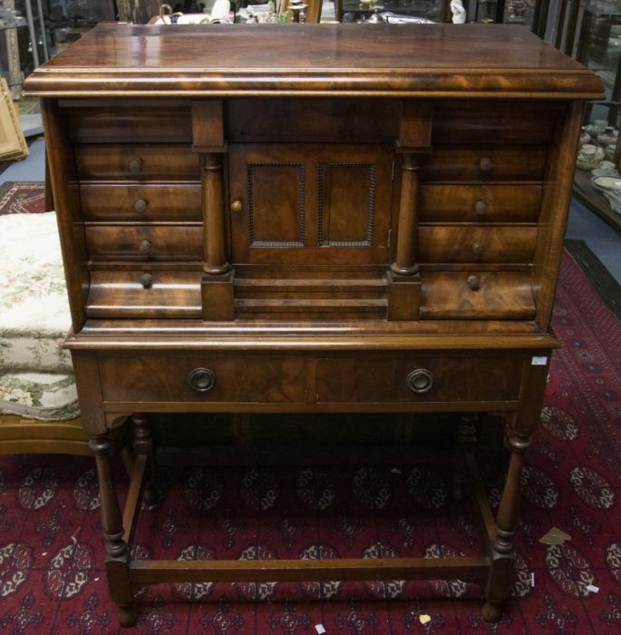 An early  20th Century mahogany tabernacle cabinet on stand, concealed drawer to frieze above a