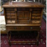 An early  20th Century mahogany tabernacle cabinet on stand, concealed drawer to frieze above a