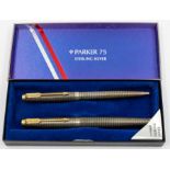 A Parker 75 sterling silver box set, containing retractable ballpoint pen, along with fountain