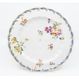 A Chelsea/Derby gold anchor feather moulded dinner plate, decorated with polychrome flower group,