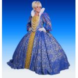 An iconic dress worn by Dame Barbara Windsor. A blue and gold bodice and skirt with crinoline and
