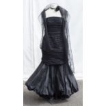 An Ian Stuart Design ballgown in black tulle, the swathed design over a taffeta / polyester mix