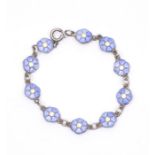 Danish Interest- a silver and enamel bracelet by Volmer Bahner, comprising small blue enamel flowers