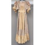 A paisley print dress by Gina Fratini, made in England, the beige floral and striped dress has