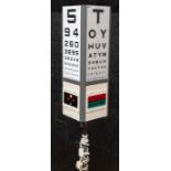 A large Retro Opticians rotating eye test box on tripod stand, with plates: one stamped Hamblin,