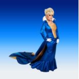 An iconic dress worn by Dame Barbara Windsor. A blue and gold bodice and skirt, together with cape