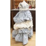 A blue and ivory slub taffeta ballgown in tiers, creating a Bopeep effect, the dres is embellished