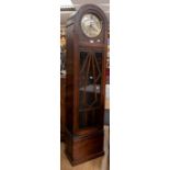 A 1930's Art Deco grandmother clock, arched shaped with Deco detail, Arabic numerals