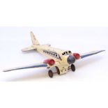 Mettoy: A Mettoy Airways tinplate, clockwork aeroplane, in need of attention, with rust marks.
