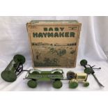 Tinplate: A rare tinplate Baby Haymaker, Made in USA by Animate Toy, c1920. Contains wind up (pull
