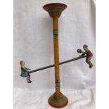Tinplate: A vintage tinplate Sea-Saw toy made in USA by Gibbs Toys, c1920. The sea-saw drops with