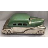 Tinplate: A vintage tinplate car, Made in England by Betel. Hinged top revealing paint pots.