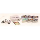 Nintendo: A Super Nintendo Entertainment System, unboxed console, together with one controller,