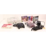 Sega: An unboxed Sega Saturn console, together with two controllers and cables, a boxed Sega