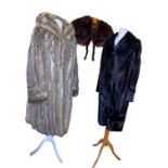 A vintage wolf fur coat along with a ponyskin coat and a fox fur cape (3)