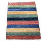 A small sized 20th century Iranian rug with stripes of ombre colours and three mountain goats (1) 83