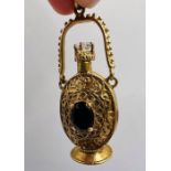 A 9ct gold scent bottle set with rock crystal and garnet. Hallmarked 1966 for London. Sponsor's mark