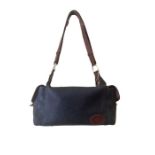 A zip top mulberry bag in a boxy shape with a pouch at either end, an interior zipped pocket. A