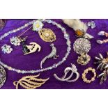 A very large quantity of costume jewellery, both vintage and contemporary across five boxes