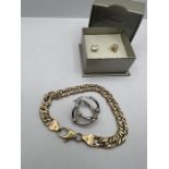 A 9ct gold fine double linked bracelet, stamped 9kt and made In Italy, along with a pair of white