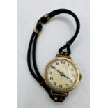 A 1920s ladies 9ct gold wristwatch. Gold dial with arabic numerals. Marked Swiss made. Mechanical