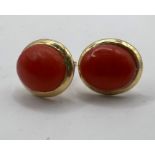 A pair of yellow metal earrings, set with precious coral, stamped with Italian goldsmith mark and "