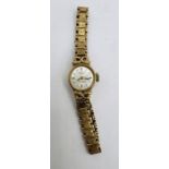 A 9ct gold Rotary 21 Jewels ladies wristwatch with 9ct bracelet. Silvered baton dial. Gross weight