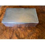 An Art Deco sterling silver covered wooden Cigar case, with woven type pattern and a hinged lid.