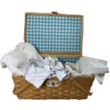 A gingham lined picnic hamper containing antique lingerie and nightwear to include an edwardian