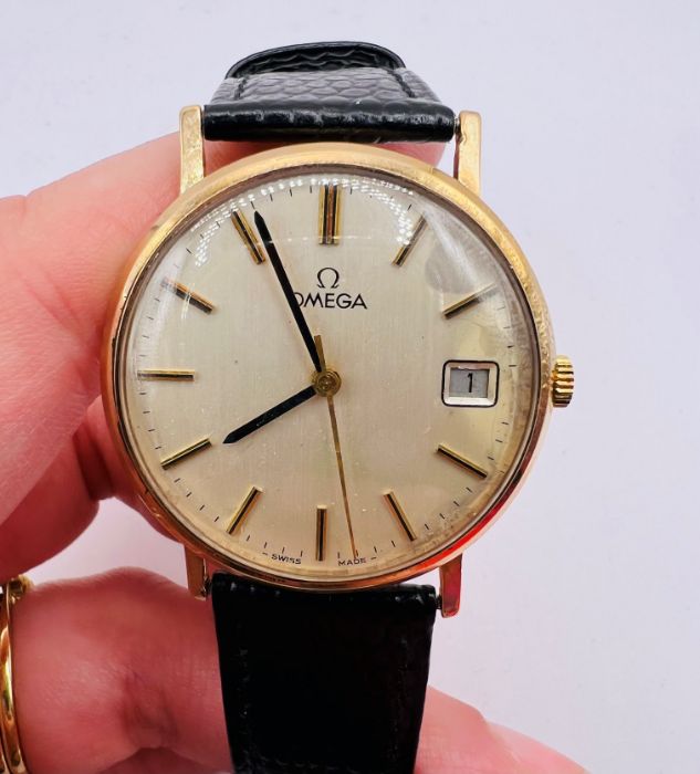 A 9ct gold Omega Gentleman's wristwatch, with engraving dated 1977. Silvered baton dial with numeric