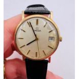 A 9ct gold Omega Gentleman's wristwatch, with engraving dated 1977. Silvered baton dial with numeric