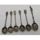 6 white metal spoons , decorated with scenes of boats , windmills , probably Dutch 49 grams