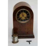 An early 20th century mahogany dome case mantle clock with eight day gong striking  movement, 34cm