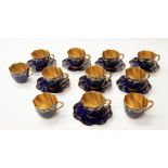 Coalport cups and saucers, floral sprig on blue ground, with gold lining, gilt loss to some