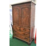 An 18th Century mahogany linen cupboard, two top cupboard doors to reveal hanging space, above two