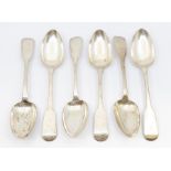 A set of six George IV Irish silver fiddle pattern table spoons with rat tail, each engraved with an