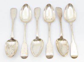 A set of six George IV Irish silver fiddle pattern table spoons with rat tail, each engraved with an