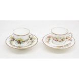 19th Century chocolate cups and saucers, one decorated in Holly design and the other with sea shells