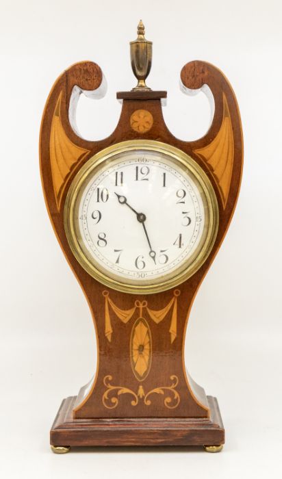 An Edwardian style inlaid mahogany mantle clock, white dial with arabic numerals, the case with swan