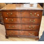 George III chest - four drawers, veneered with a chequered inlaid top, brass swing handles,