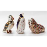 Three Royal Crown Derby silver stopper paperweights, puffin, walrus, penguin, which has damage to